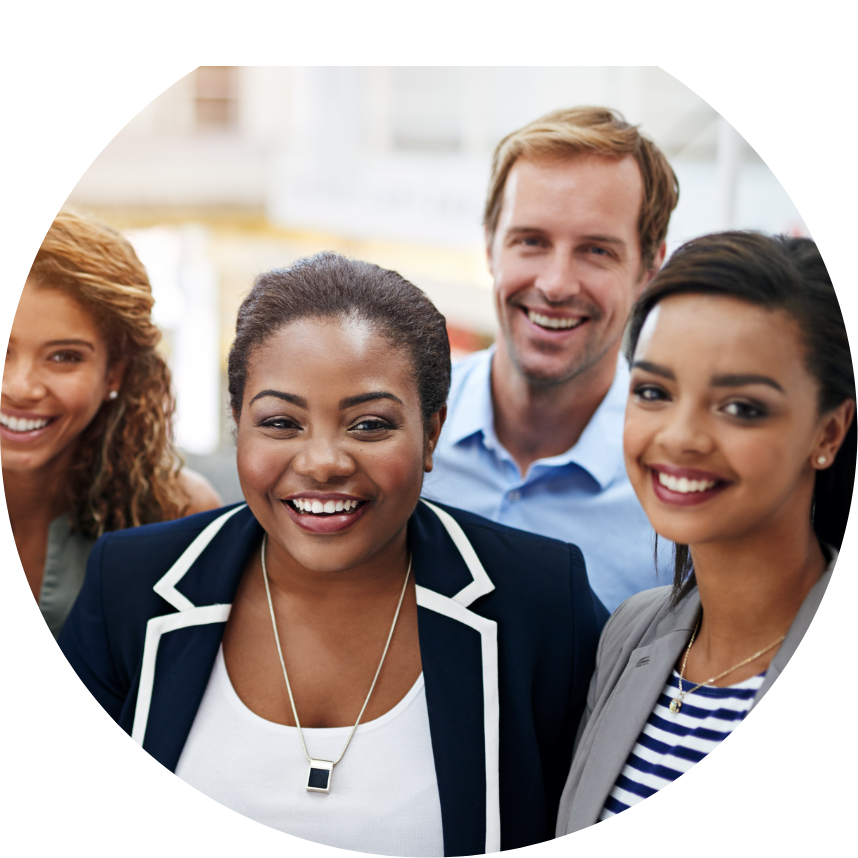 Young professionals in an office setting smiling
